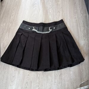 Black pleated skirt with chain detail